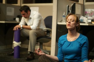 Colin (Erik Sternberger, left) strikes a typically dejected pose while Fran (Katharine Pilcher) practices “existential yoga” in The :nv:s:ble Play (photo by Andy Batt)