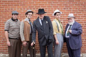 Geoff Wilson (center) plays the conniving title character in Actors’ Theatre’s updated production of Richard III (Actors’ Theatre photo)