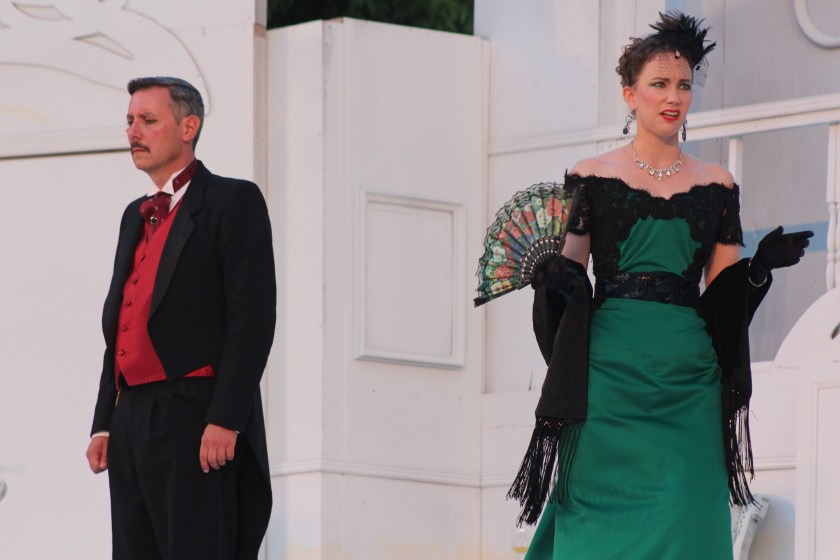 Mrs. Chevely (Beth Josephsen) blackmails Sir Robert Chiltern (Ross Shirley) into supporting a scam in Oscar Wilde’s An Ideal Husband. (photos by Richard Ades)