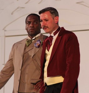 Lord Goring (Amari Ingram, left) hears a startling confession from his friend Sir Robert Chiltern (Ross Shirley). 