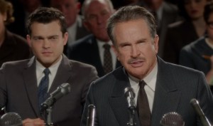 Frank Forbes (Alden Ehrenreich, left) listens as Howard Hughes (Warren Beatty) testifies before Congress in Rules Don’t Apply.
